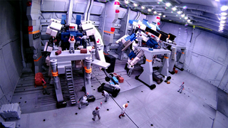 Illustration for article titled Model Hangars Look Much Better With Tiny Mecha Inside